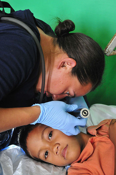 398px-US_Navy_110420-O-XX000-012_Aislinn_Mangan,_a_registered_nurse_with_Project_Hope,_tends_to_a_patient_during_a_Pacific_Partnership_2011_medical_commu  